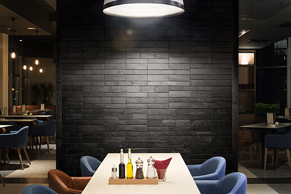 Modern restaurant interior with concrete wall