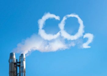 Smoke of chimney writing CO2 in the sky