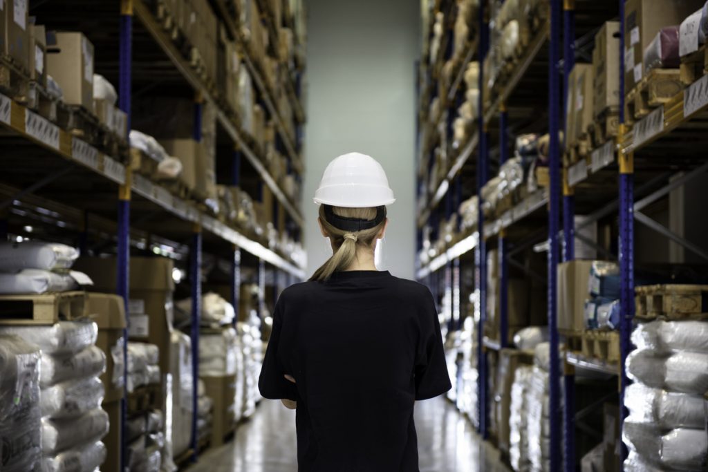 Rear view of woman in warehouse