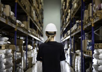 Rear view of woman in warehouse